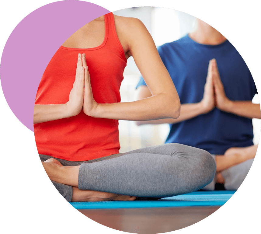 Woman and man in yoga meditation.